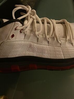 White Low-Top Athletic Sneaker with Red Accents